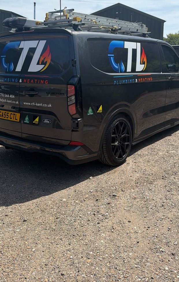 Close rear view of the sign-written black CTL Plumbing & Heating van with the OFTEC and Gas Safe badges and GA55 CTL plate